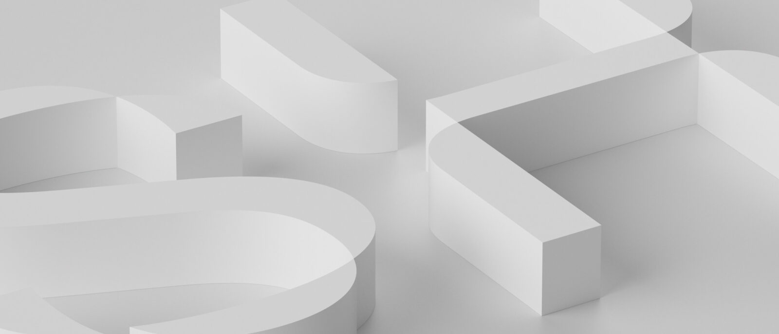 A number of white shapes on a white surface.